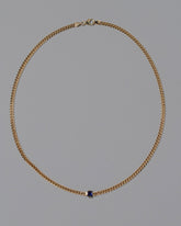 Blue Sapphire Fold Necklace on grey color background.