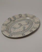 Suzanne Sullivan Spiral Oval Platter on light color background.