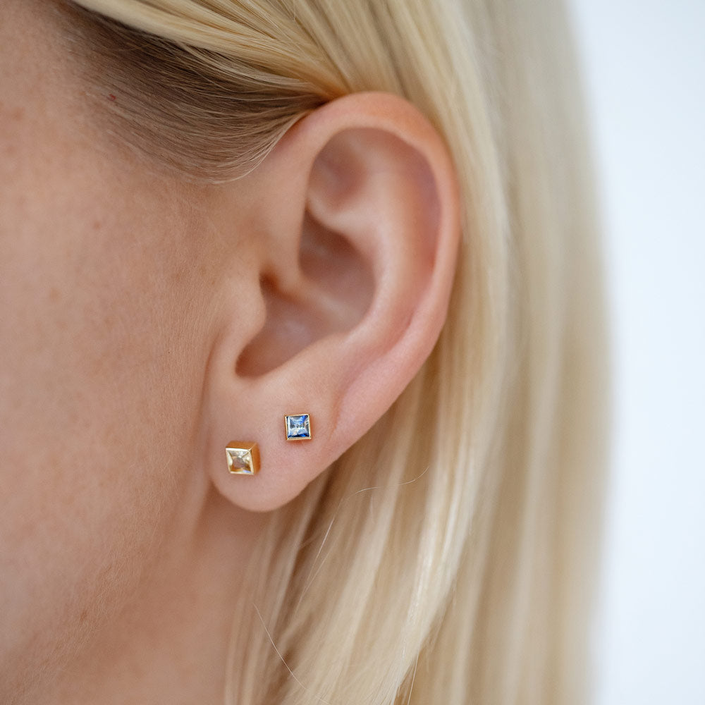 product_details::Bicolor Sapphire Square Frame Stud Earrings and Blue Sapphire Square Frame Stud Earrings on model.