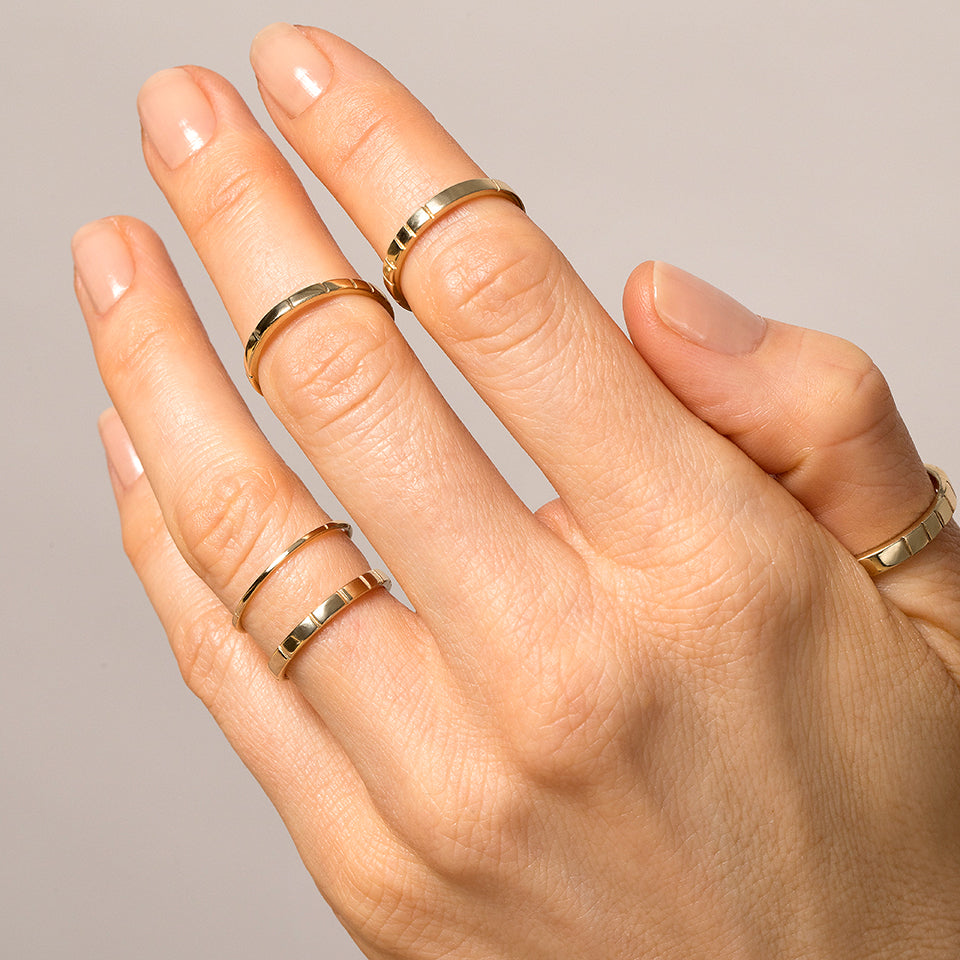 product_details::Yellow Gold Etched Lines Bands on model.