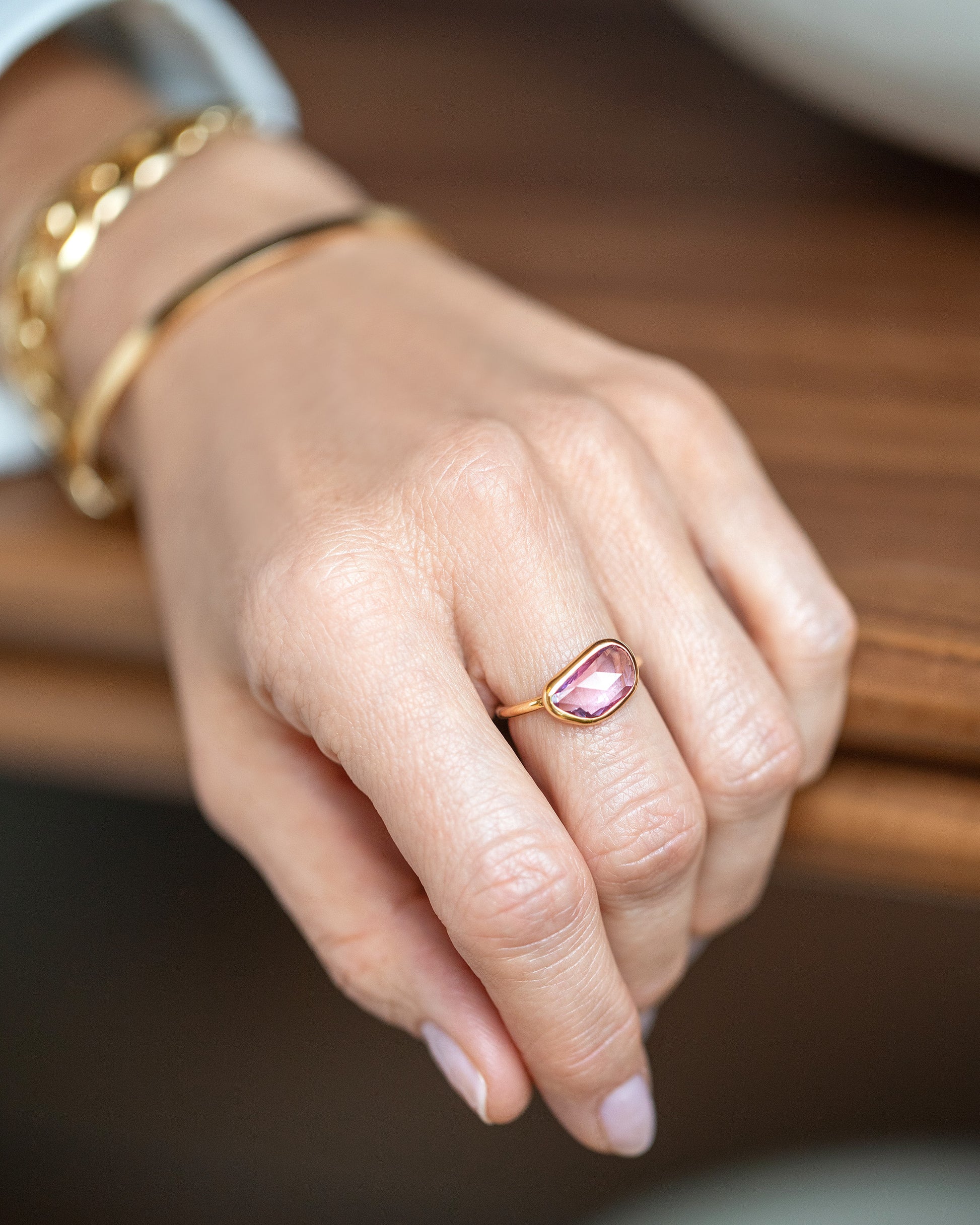 Gusher Pink Sapphire Ring 011 on model.