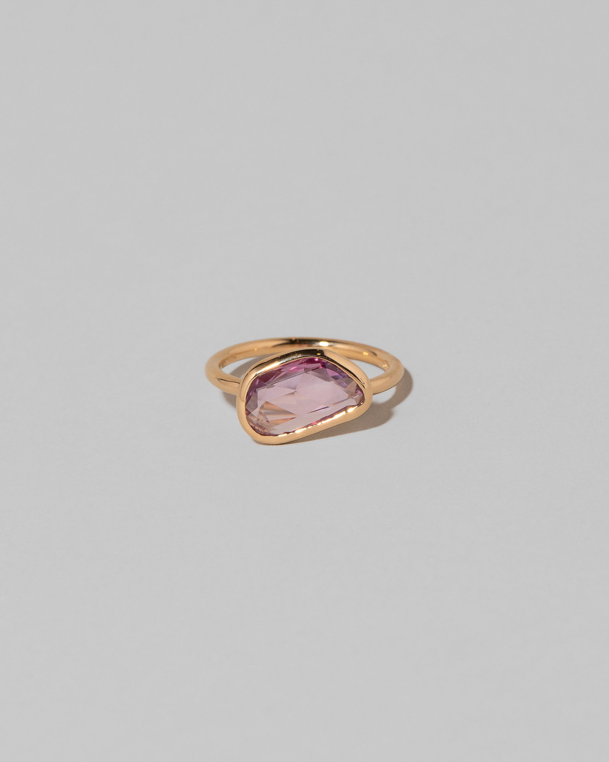 Gusher Pink Sapphire Ring 011 on light color background.