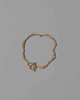 CRZM Gold Foothill Bracelet on light color background.