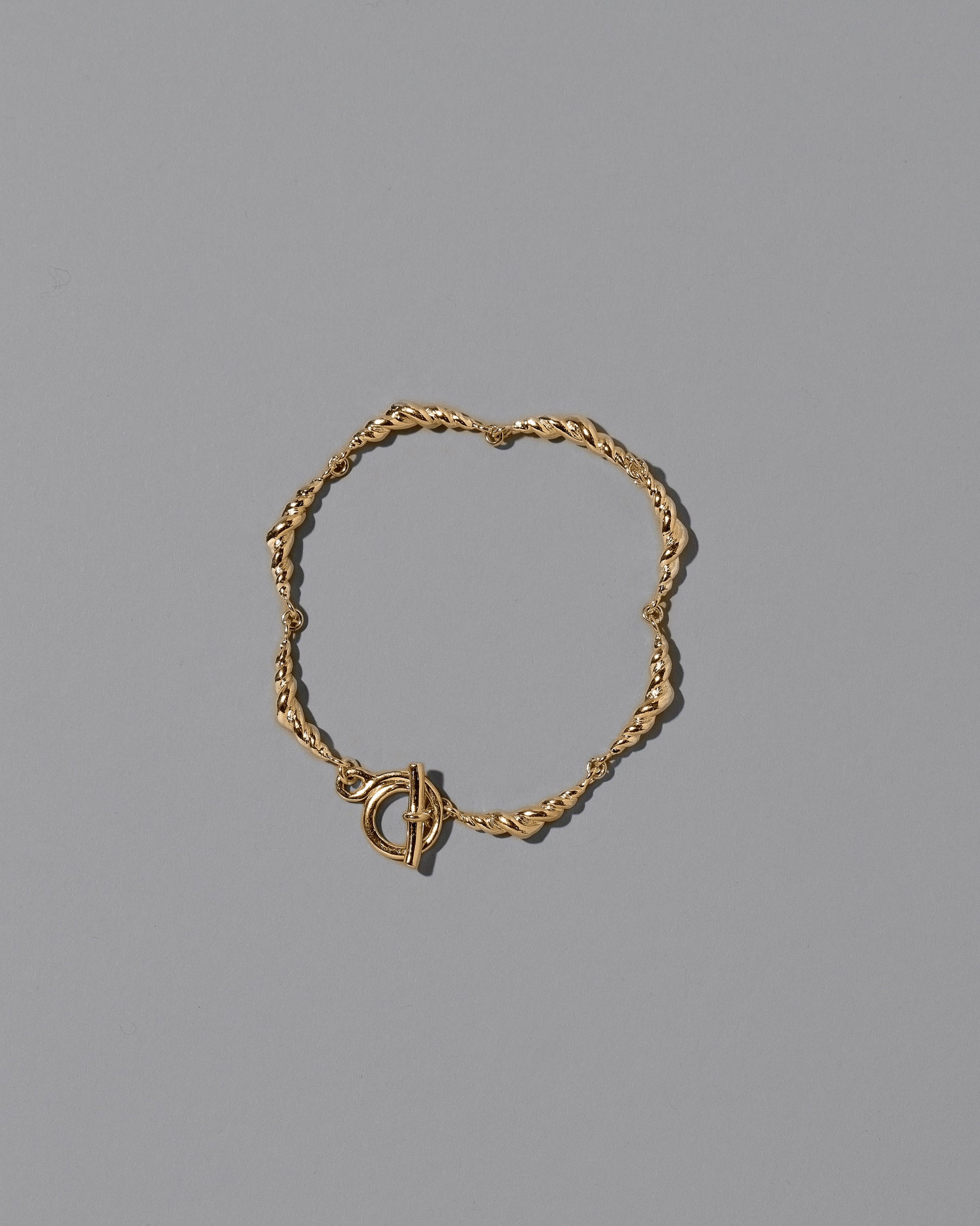 CRZM Gold Foothill Bracelet on light color background.