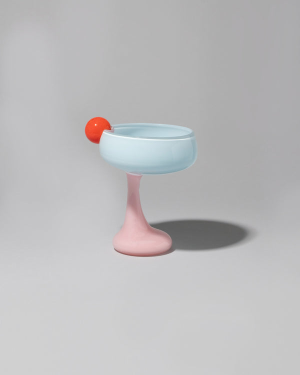 Helle Mardahl Grapefruit, Blue Jelly & Milky Rose Bon Bon Cocktail Glass on light color background.