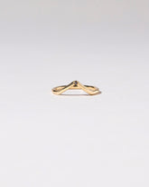 Gold Single Stone Black Diamond High Peak Band on light color background.