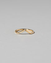 Gold Three Stone White Diamond High Peak Band on light color background.