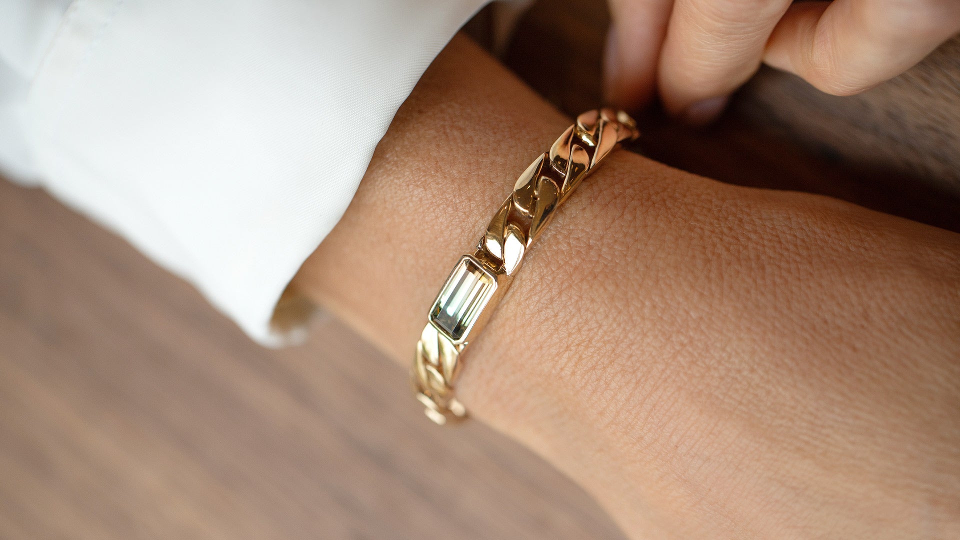 Photo of Identity Chain Bracelet Tanzanite worn on model. 