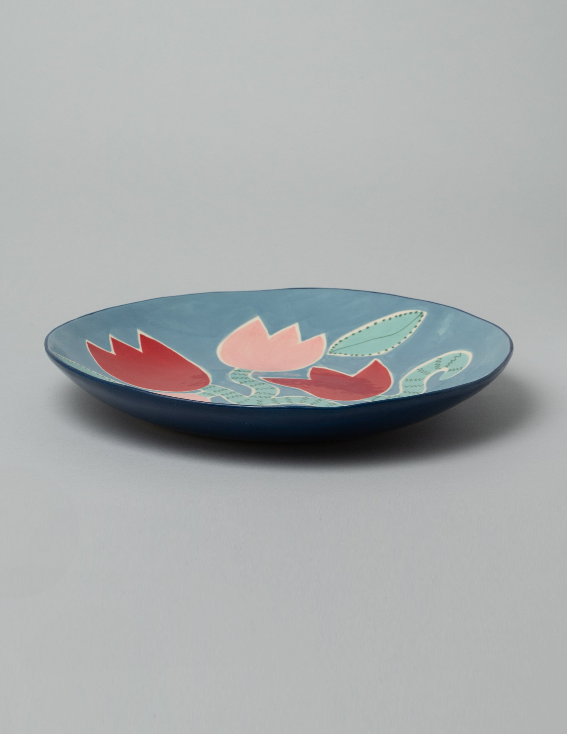 Laetitia Rouget Blue Tulip Platter on light color background.