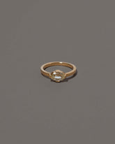 Beholden Ring on grey color background.