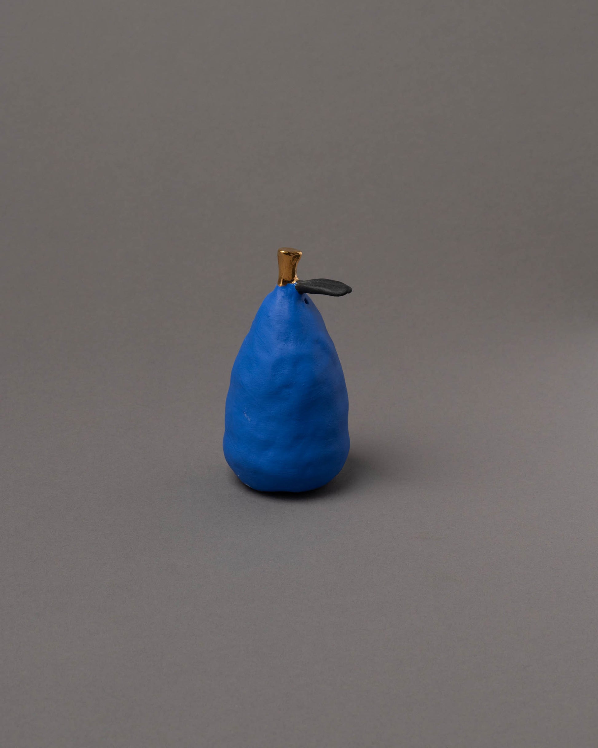 Suzanne Sullivan Blue Pear Considering Utility Objects on light color background.