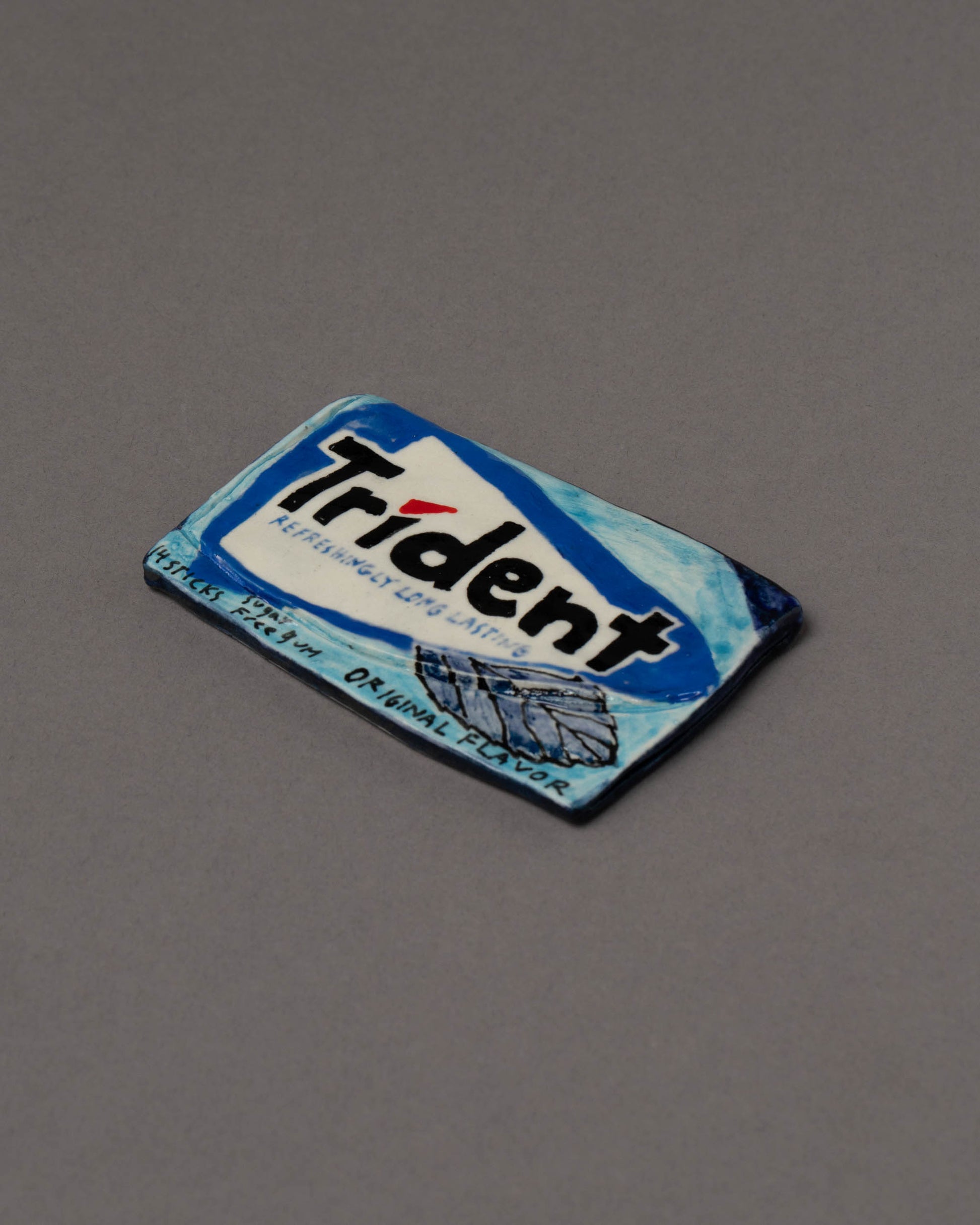 Suzanne Sullivan Trident Gum Considering Utility Objects on light color background.