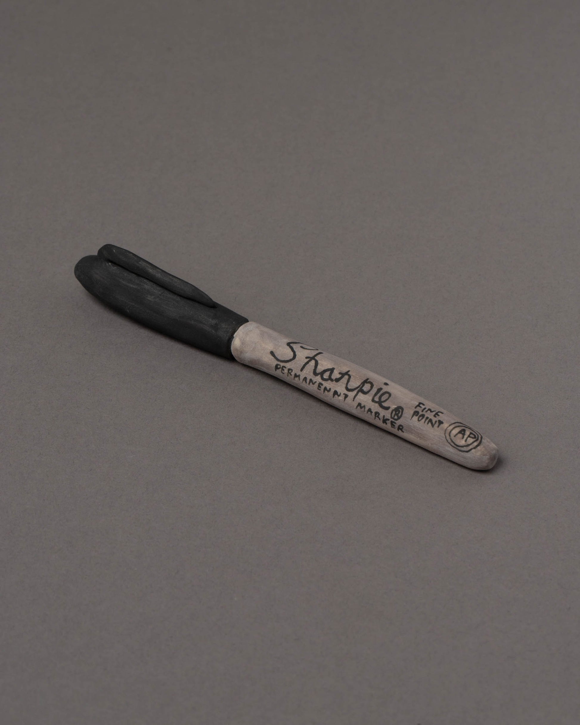 Suzanne Sullivan Sharpie Considering Utility Objects on grey color background.