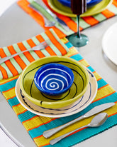 Styled image featuring the Casa Veronica Azul Mini Vida Bowl, Sol Vida Bowl, and Leche Vida Plate, and a Fazeek Teal Wave Flute Set.