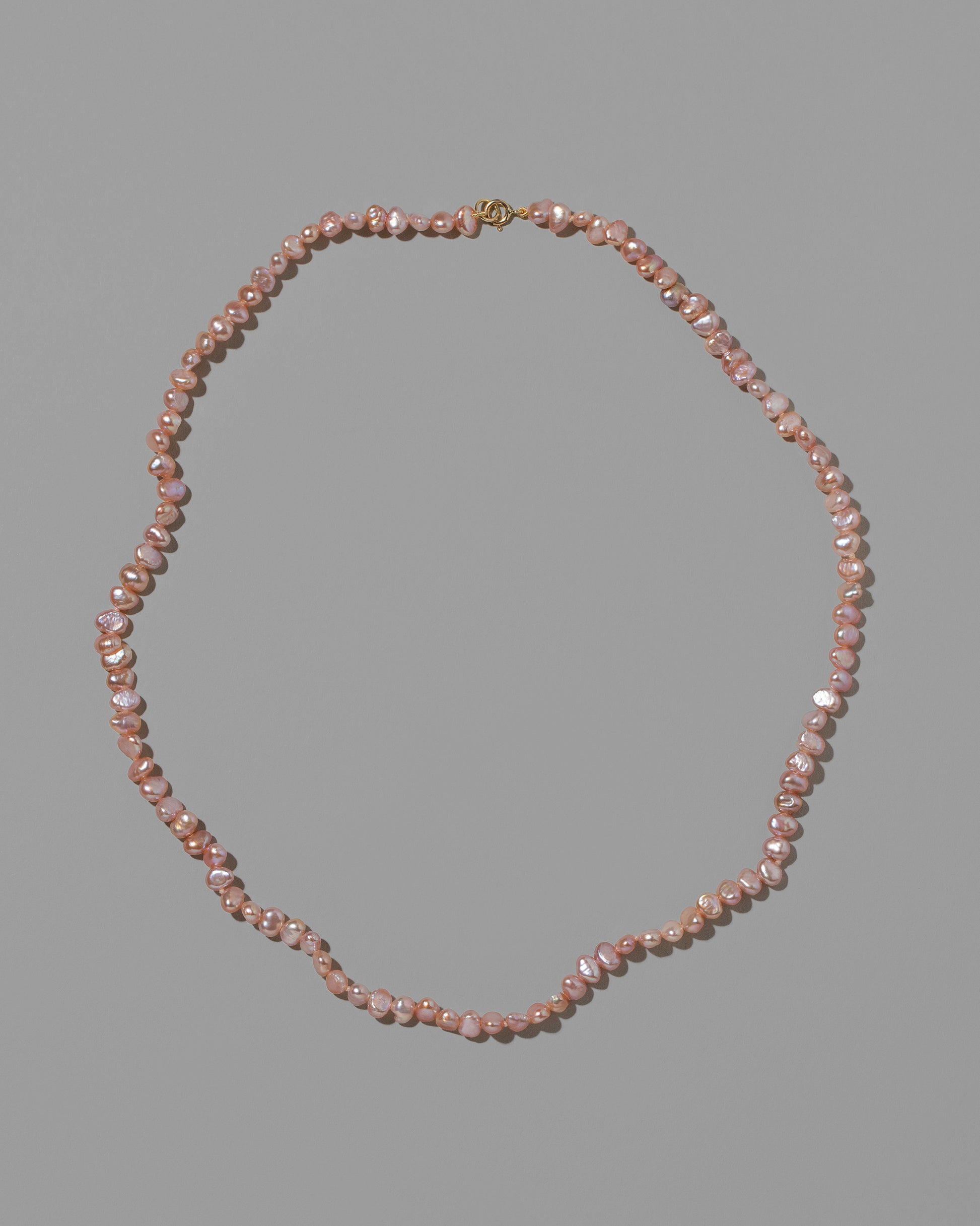 Pink Peony Baroque Pearl Necklace on light color background.