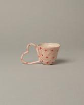 La Romaine Editions x Samantha Kerdine  Pink Heart-shaped Cup on light color background.