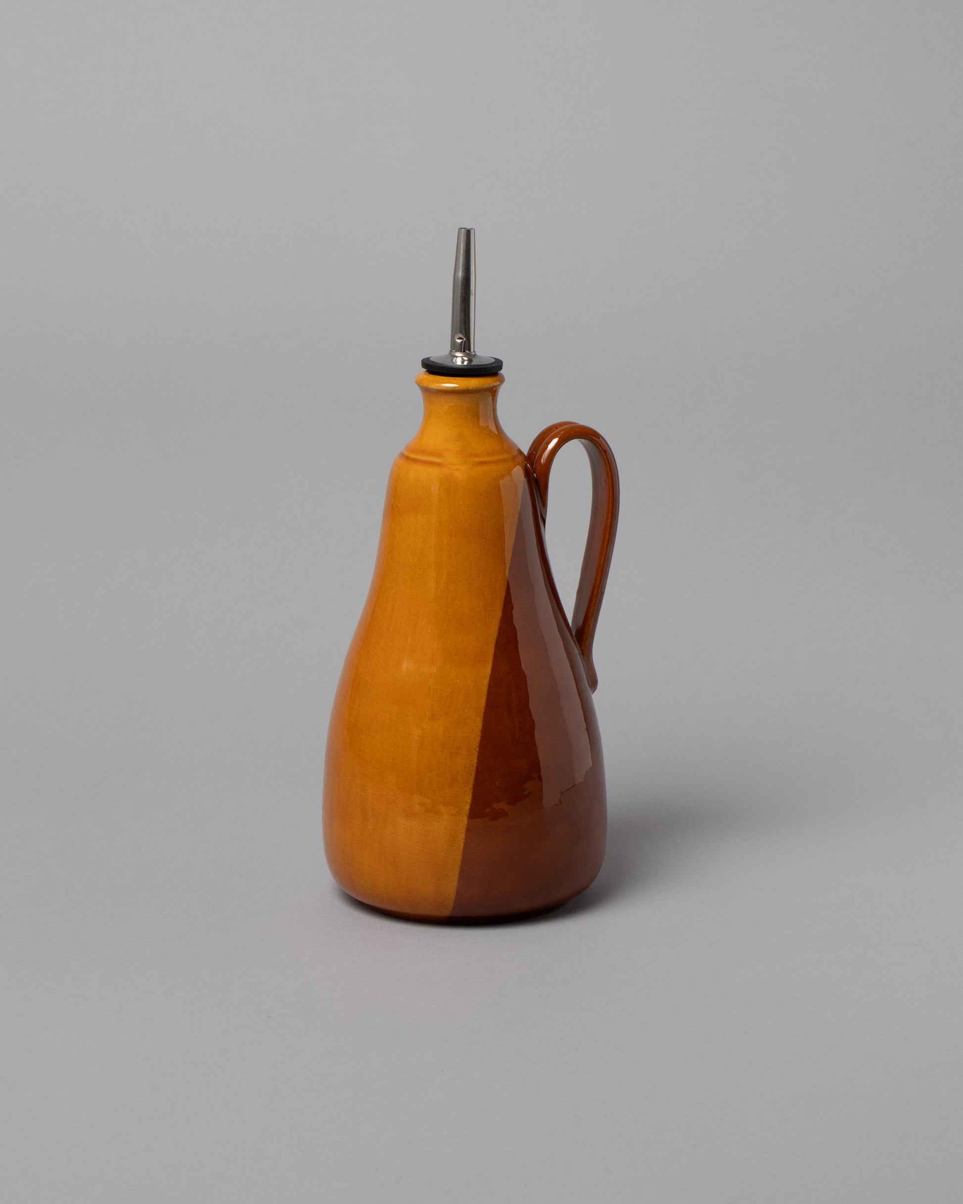 La Ceramica Vincenzo Del Monaco Caramel Oil Bottle on light color background.