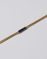 Closeup details of the Blue Sapphire 3.4mm Identity Chain Bracelet on light color background.