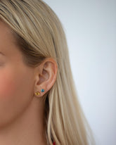 Mega Yellow Beryl Martini Stud Earring and Blue Sapphire Martini Stud Earring on model.