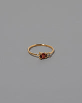 Red Garnet Teardrop Ring on light color background.