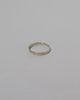 Samples & Imperfects 2.6mm White Gold Square Wire Band on light color background.