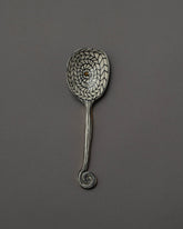 Suzanne Sullivan Bring Every Idea To Life Serving Spoon on grey color background.