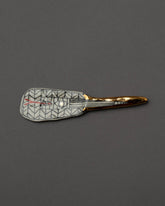 Suzanne Sullivan Considering Utility Cheese Knife Two on grey color background.