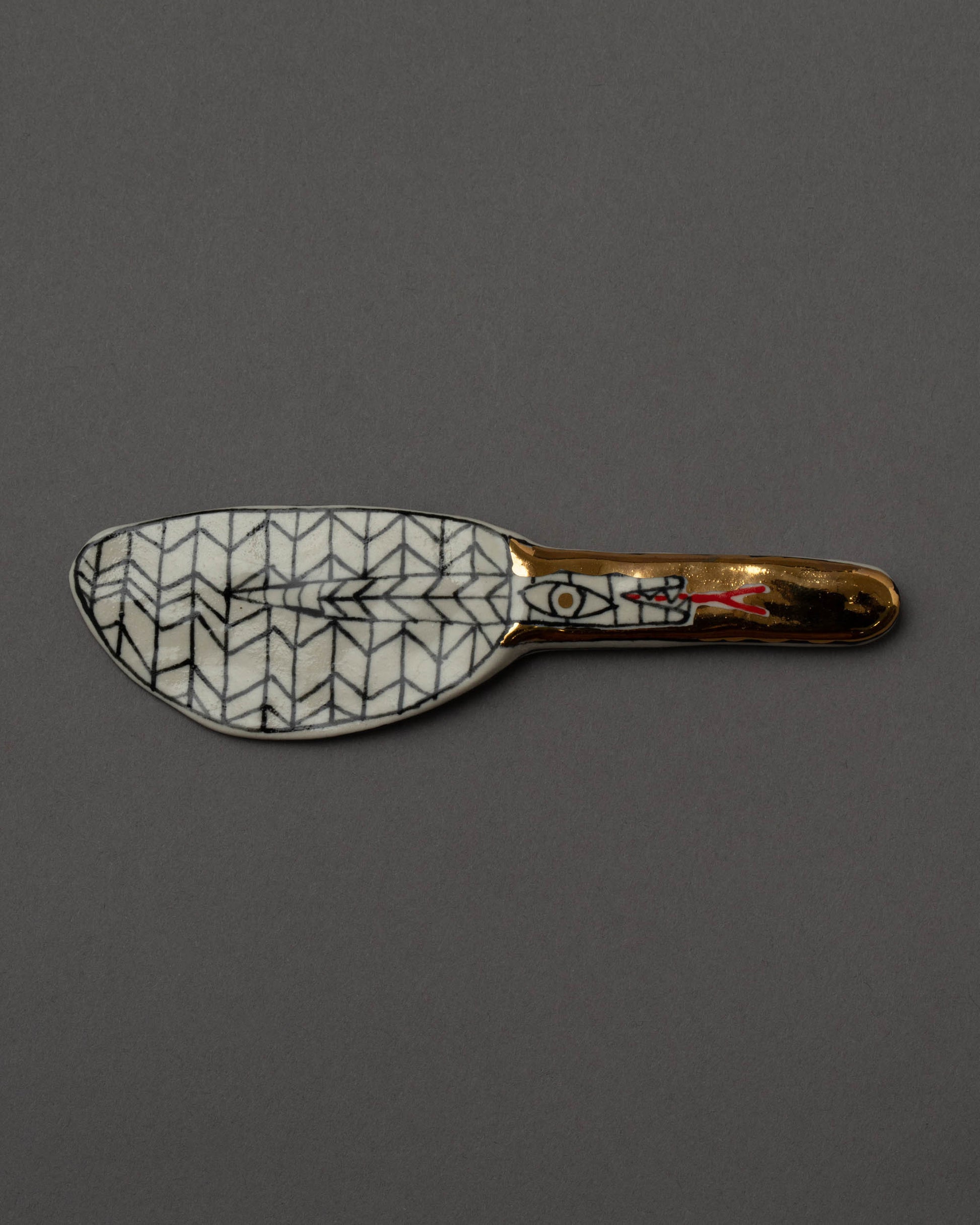 Suzanne Sullivan Considering Utility Cheese Knife One on grey color background.