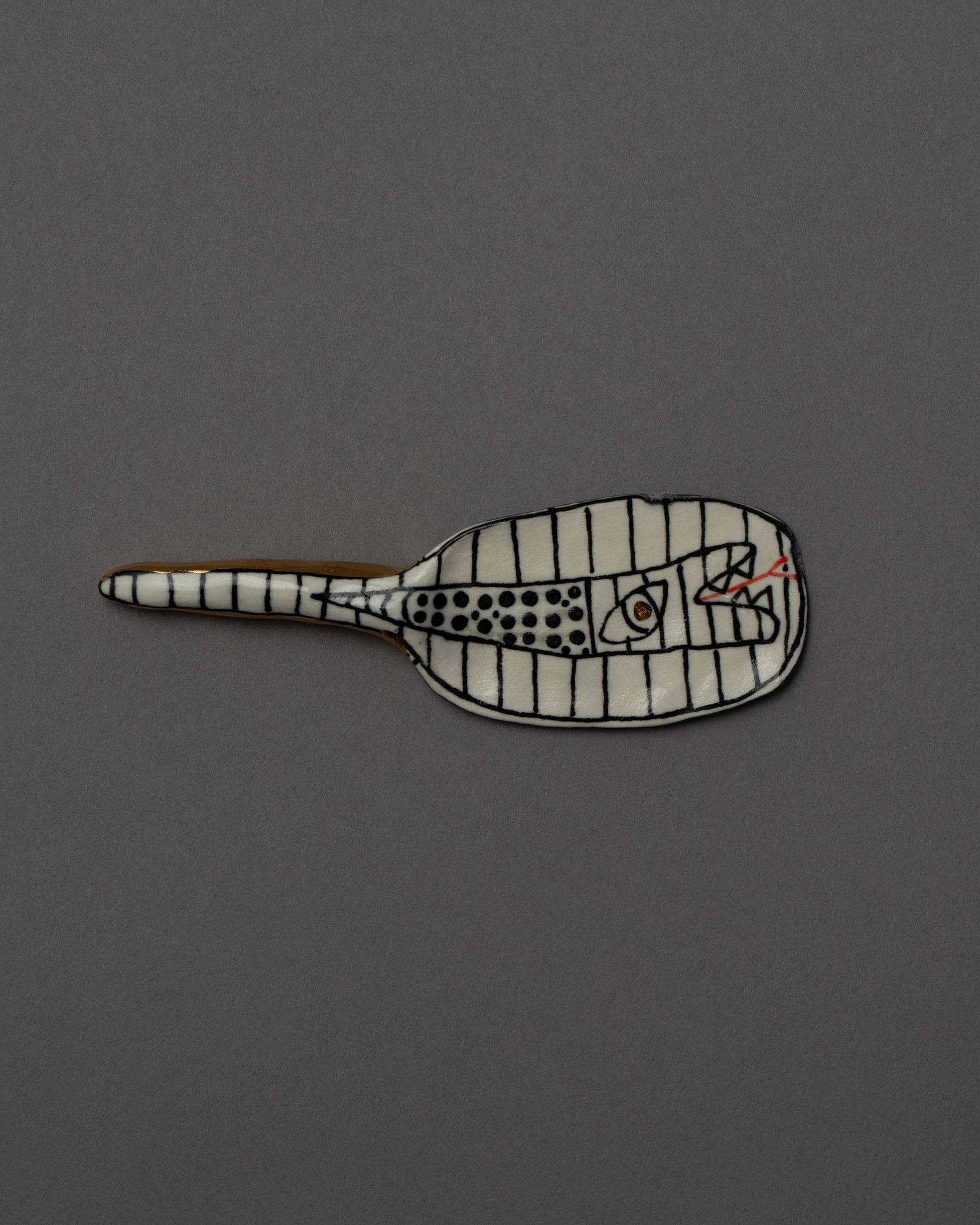 Suzanne Sullivan Considering Utility Cheese Knife Four on grey color background.