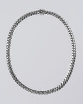 Silver Cuban Chain on light color background.