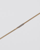 Closeup details of the 2.4mm Diamond Identity Chain Bracelet on light color background.