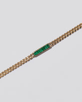 Closeup details of the Emerald 3.4mm Identity Chain Bracelet on light color background.