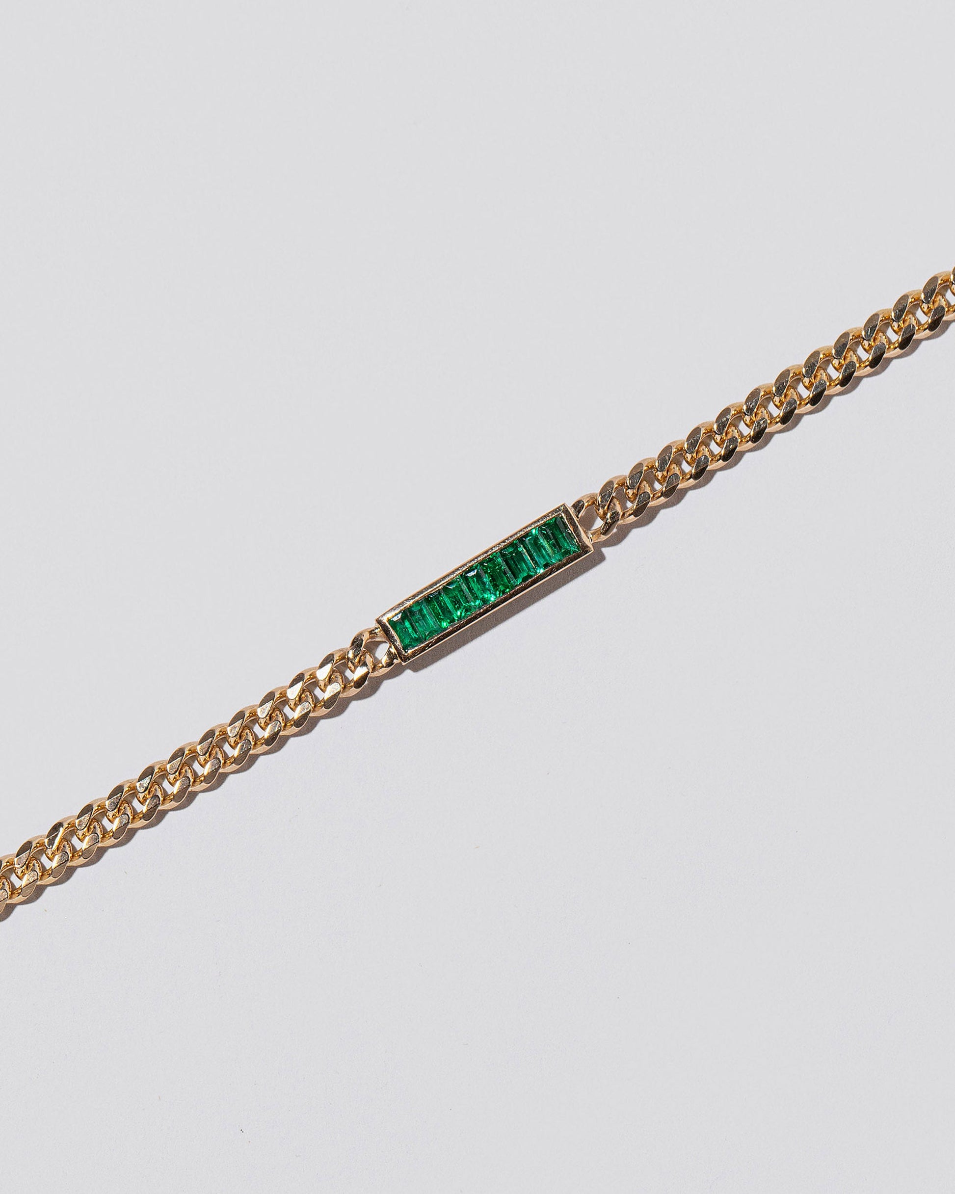 Closeup details of the Emerald 3.4mm Identity Chain Bracelet on light color background.