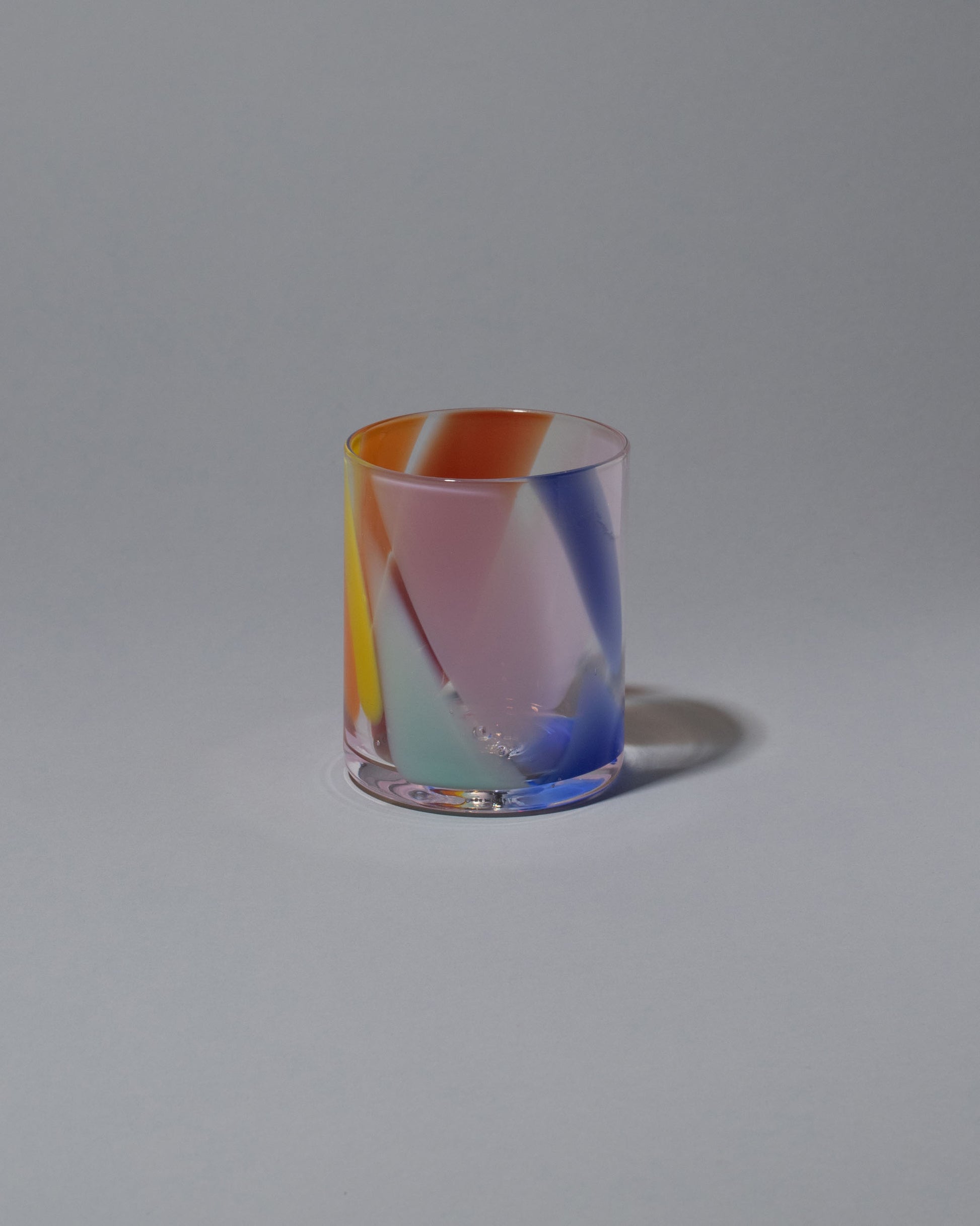 Bow Glassworks Tutti Frutti Splash Cup on light color background.