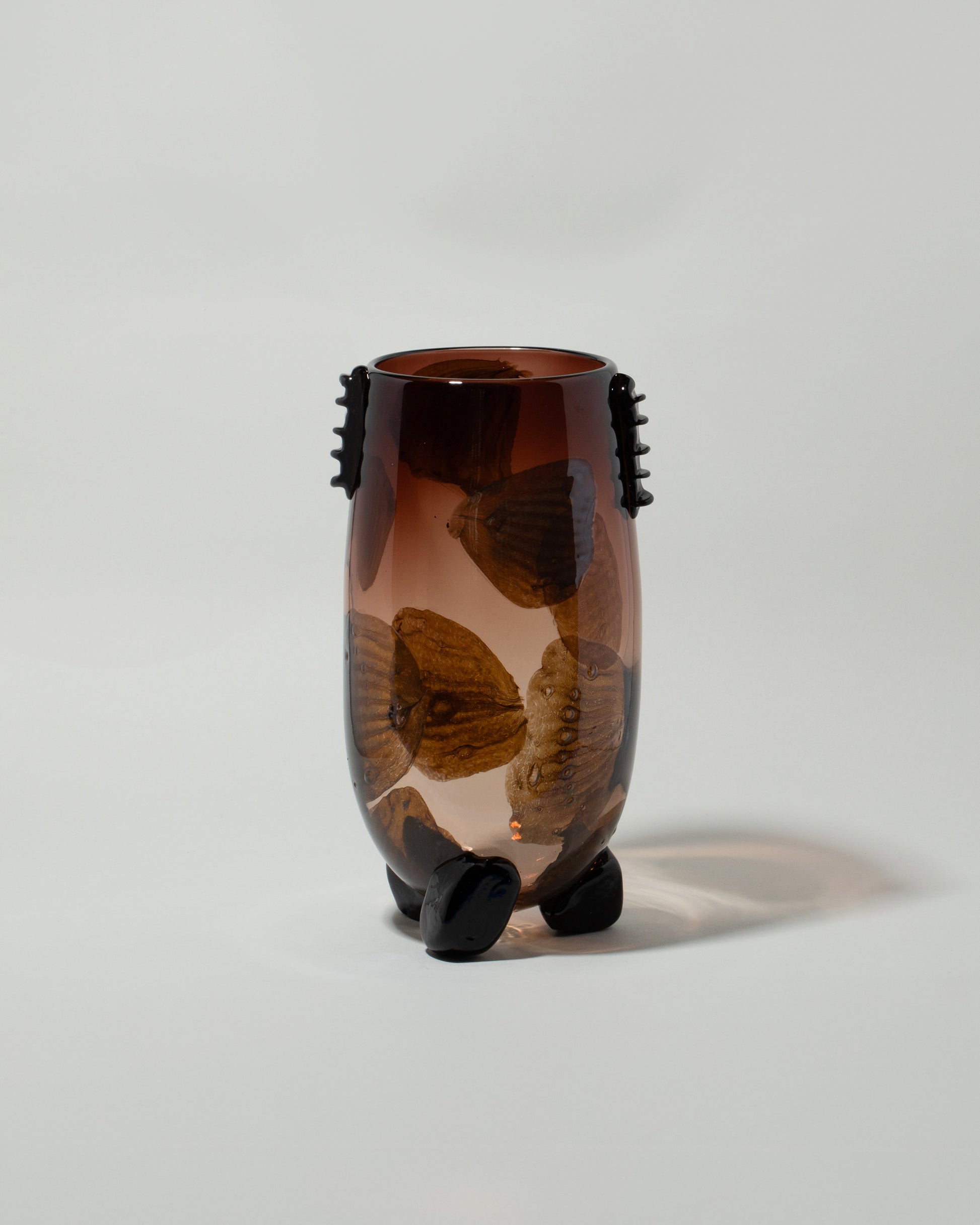 Jess Humphrey For Your Pleasure Vessel With Poppy Petals And Pods on light color background.