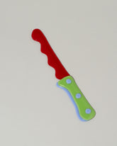 Jonny Campolo Red For Your Pleasure Amused Boosh Knife on light color background.
