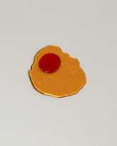 Jonny Campolo Transparent Yellow For Your Pleasure Amused Boosh Egg on light color background.