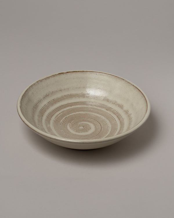 Jeremy Ayers Combed Shallow Bowl on light color background.