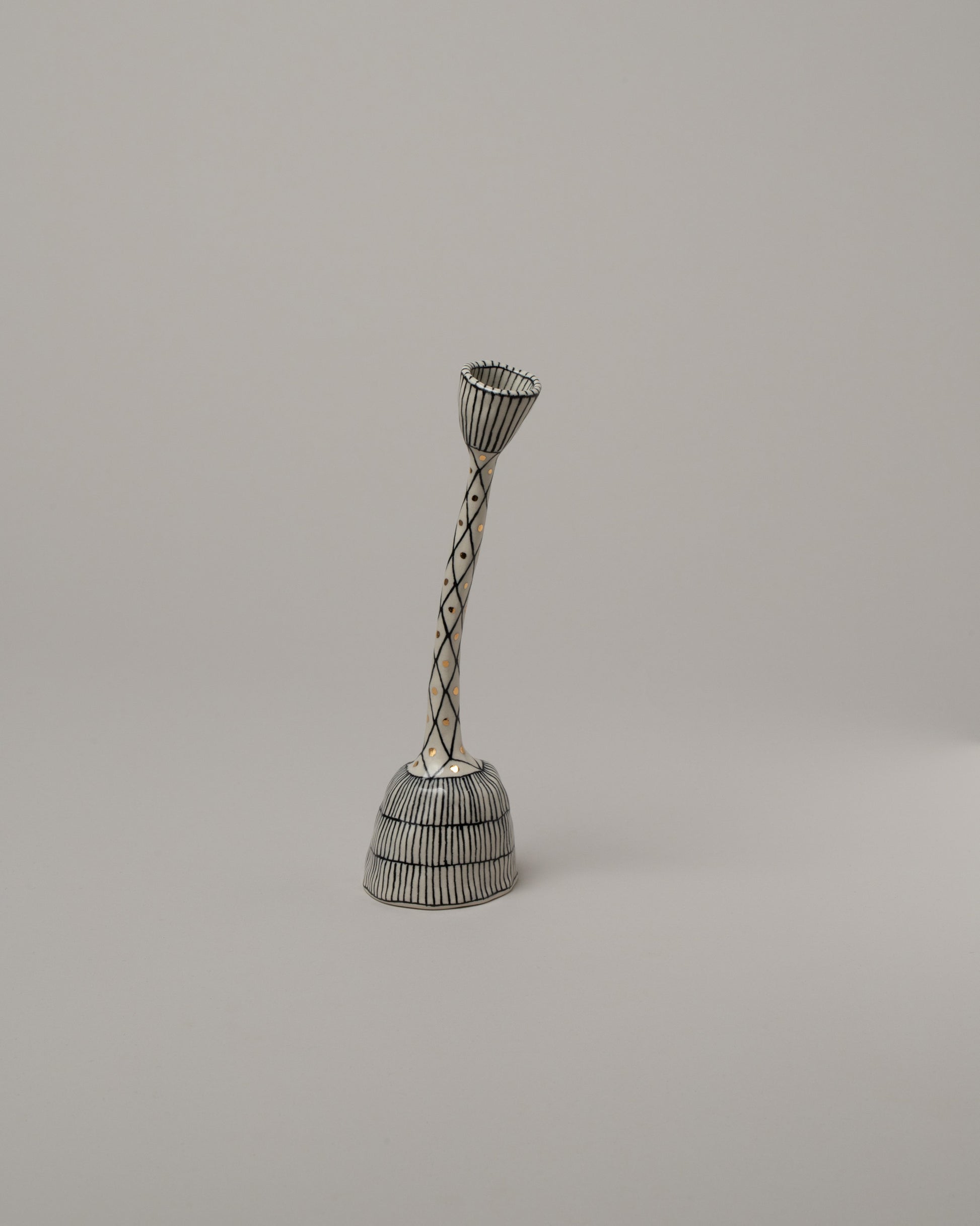 Suzanne Sullivan Seven Candlestick on light color background.