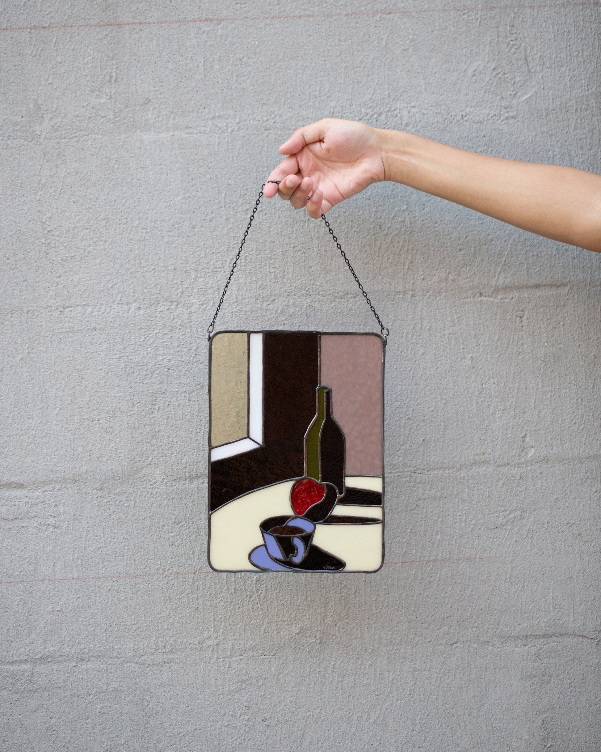 Soeun Lee Wine & Tea Stained Glass on light color background.