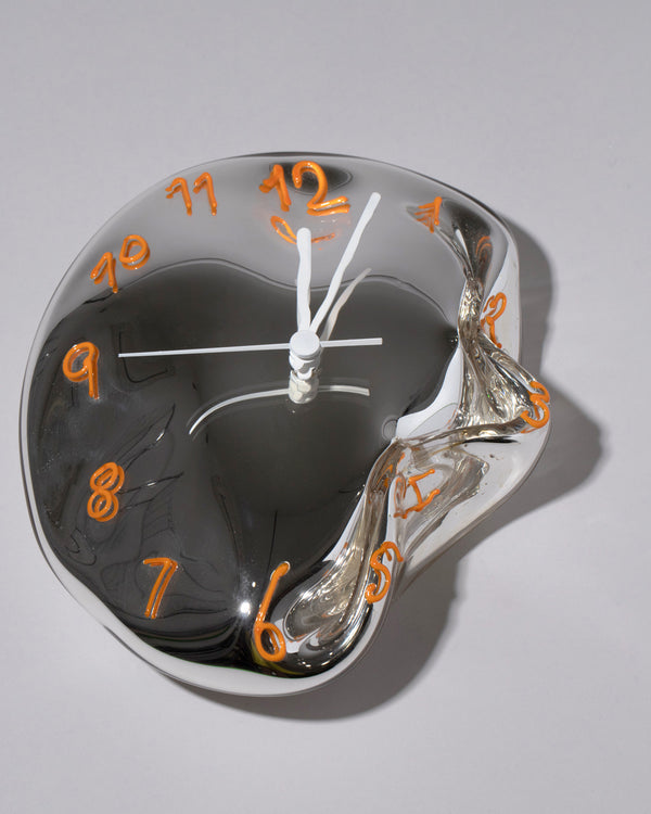 Orange One Glass Wall Clock on light color background.