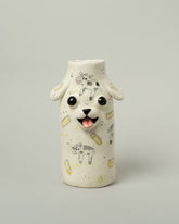 Katie Kimmel For Your Pleasure Buttermilk Puppy Vase on light color background.