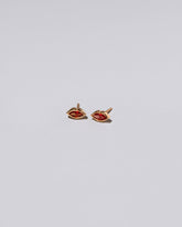 Red Kiss Stud Earrings on light color background.