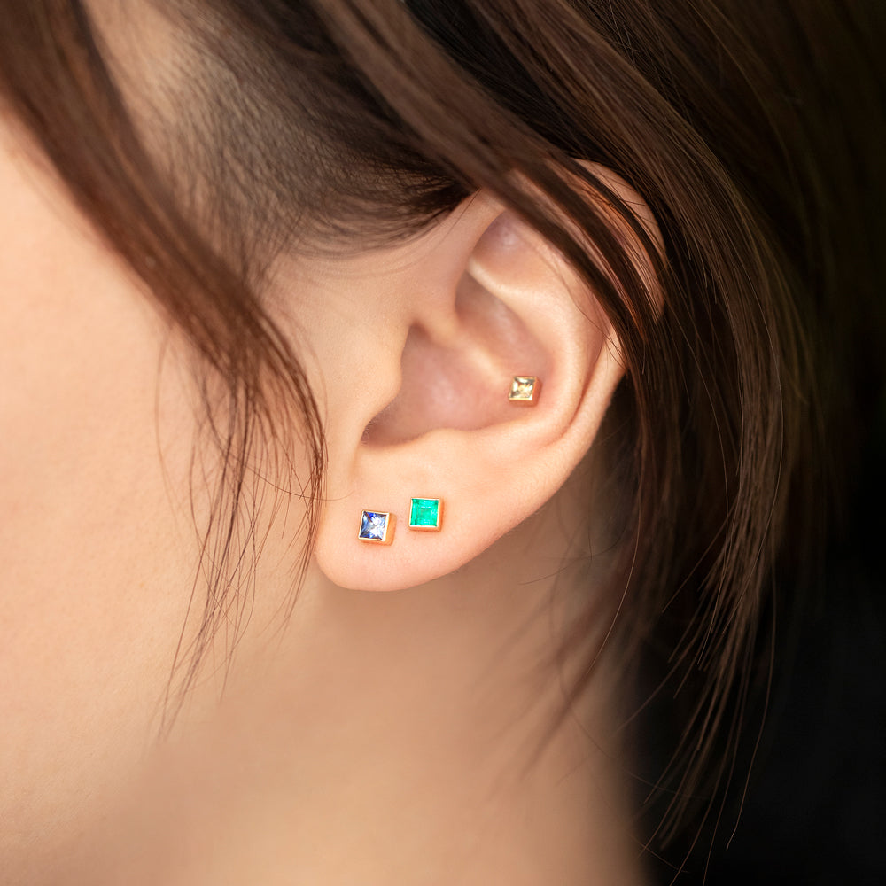 product_details::Square Frame Stud Earrings on model.