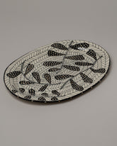 Suzanne Sullivan Petal Oval Platter on light color background.