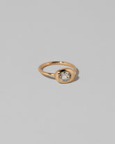 View from the side of the Oval Sapphire Equalize Ring on light color background.