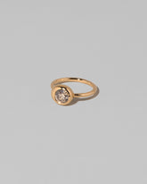 View from the side of the Champagne Diamond Grand Level Ring on light color background.