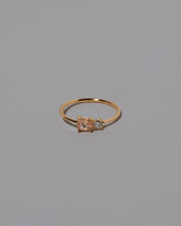 Peach Sapphire Teardrop Ring on light color background.