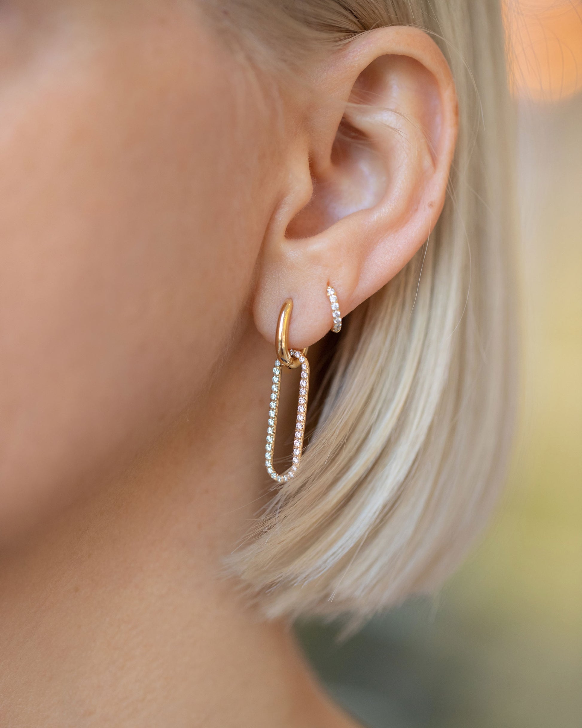 Pavé Link Huggie Hoop Earrings on model.