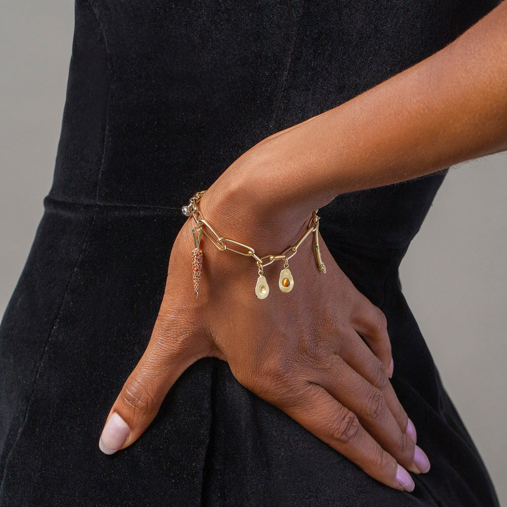product_details::Avocado Charm, Asparagus Charm, Carrot Charm and Long Loop Chain Bracelet on model.